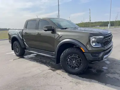 The 2024 Ford Ranger Raptor, finished in Shelter Green with refined Ebony leather-trimmed seats, is...