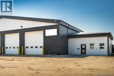 4,900 Square foot shop with two pull-thru bays situated on 1.54 acres of fully fenced and graveled y...
