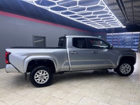 The 2025 Toyota Tacoma SR5, clad in a refined Silver finish, is ready to tackle any terrain with its... (image 1)