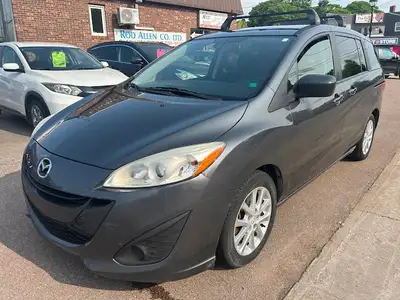 This is a 2013 Mazda 5 6speed standard. Great driving vehicle, seven passenger captain seats middle...