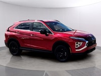 The 2026 Mitsubishi Eclipse Cross NOIR S-AWC, clad in a striking red exterior, combines the robust h... (image 1)