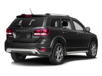 The 2017 Dodge Journey Crossroad, presented in a striking black finish, is equipped with an agile al... (image 1)