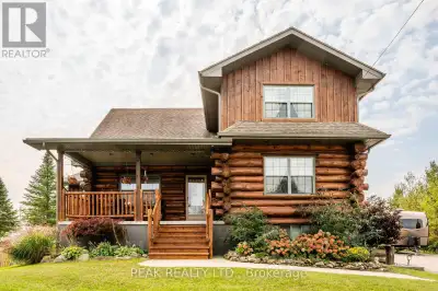 Move in and enjoy the summer in this custom designed, custom built, locally sourced white pine, log...