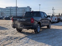 The 2026 Ram 1500 Big Horn Crew Cab in Granite Crystal Metallic combines rugged capability with refi... (image 6)
