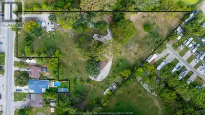 Discover 3.13 acres of rare opportunity in one of Leamington's most sought-after locations. This uni...