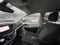 Experience the 2024 Chrysler Grand Caravan SXT in a pristine white finish, complete with efficient f... (image 5)