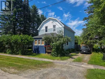 Stunning 1.5-storey home featuring 3 bedrooms, 1.5 bathrooms, a spacious workshop, and a fully fence...
