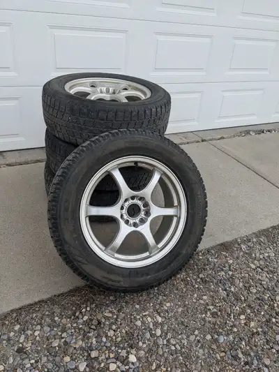 Here is a set of 4 - 17 X 7 multi fit wheel rims with winter tires, located in High River, AB. These...