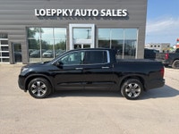 2019 Honda Ridgeline Touring AWD – Luxury, Capability & Reliability Loeppky Auto Sales is proud to o... (image 1)
