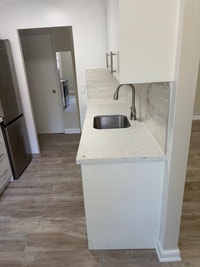 Lower level apartment unit available for rent, this freshly painted bachelor apartment is in a clean... (image 2)