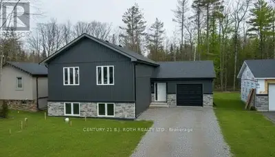 Beautiful *custom raised bungalow* on a treed 60 x 270 ft lot with no neighbours behind, just a shor...