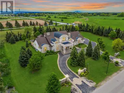 Impeccably nestled in The Bluffs, this extraordinary estate spans over 11,000 sqft. of luxurious liv...