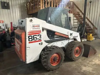 1998 BOBCAT 863 CAB, HEAT, AUXILLARY HYDRAULICS, BUCKET, HAVE SEVERAL WORK ORDERS INCLUDING NEW TIMI...