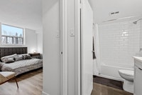Fully renovated spacious suite features kitchen with modern features and finishes including laminate... (image 8)