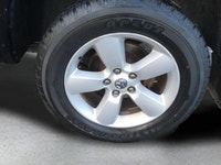 The 2022 Ram 1500 Classic SLT 4x4 Crew Cab in striking black is the perfect combination of power and... (image 8)