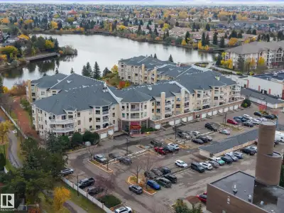 ~ TOP FLOOR ONE BEDROOM PLUS DEN ~ GORGEOUS VIEW OF THE LAKE ~ AIR CONDITIONING ~ VAULTED CEILINGS W...