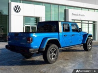 Conquer every landscape in this 2023 Jeep Gladiator Rubicon, gleaming in Hydro Blue Pearl. With only... (image 4)