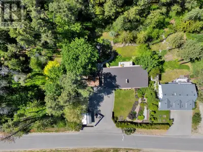 A beautifully renovated 4-bedroom, 3-bathroom walk-out rancher nestled on a pristine 0.4-acre lot wi...