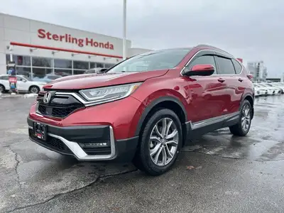 Command the road in the breathtaking Radiant Red Metallic 2021 Honda CR-V Touring, a sophisticated s...