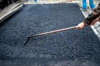 Resurfacer ou réparation d'asphalte