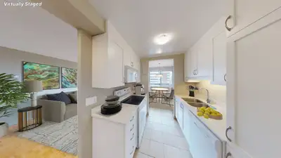 Renovated 2 Bedroom, 1 Bath Suite featuring a formal dining area, open concept kitchen with quartz c...