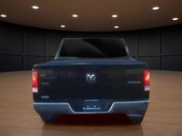 The 2022 Ram 1500 Classic SLT 4x4 Crew Cab in striking black is the perfect combination of power and... (image 6)