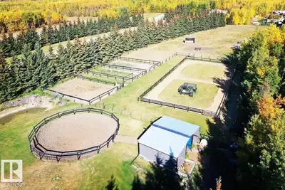 Welcome to an EXTREMELY PRIVATE 4.53 acre property just minutes from Pigeon Lake! Gated, crossed fen...