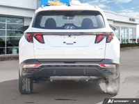 The 2023 Hyundai Tucson Preferred, featuring a brilliant Crystal White exterior complemented by a re... (image 4)