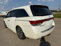 2014 Honda Odyssey Touring — White exterior, Brown interior. This Odyssey is powered by a 3.5L V6 th... (image 4)