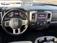 The 2022 Ram 1500 Classic SLT 4x4 Crew Cab stands out with its sophisticated gray exterior and power... (image 3)