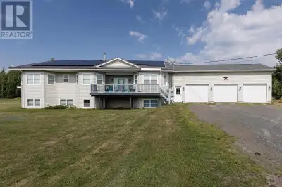 SOLAR-POWERED RAISED BUNGALOW ON 18 ACRES! Modern Country Living Just 15 Minutes from Amherst. Exper...