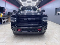 The 2019 Ram 2500 Laramie, with its bold black exterior and sophisticated 4x4 drive, promises except... (image 7)