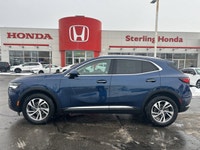 The 2023 Buick Envision Essence, presented in a sophisticated Gray finish, masterfully blends luxuri... (image 3)