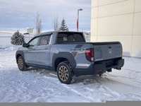 Our 2023 Honda Ridgeline Touring in Sonic Grey with the Honda Performance Development Package is in... (image 6)