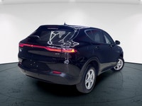 Introducing the 2024 Dodge Hornet GT AWD, a dynamic SUV that commands attention with its black-on-bl... (image 3)