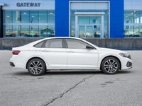 The 2024 Volkswagen Jetta Comfortline stands out in a refined White finish that complements its slee... (image 2)