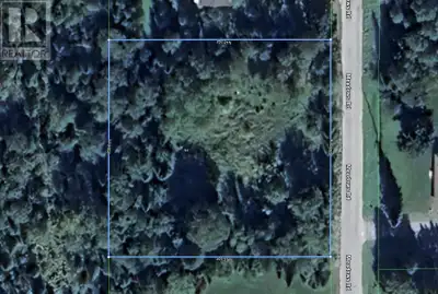 Just under 1 acre, level Rural Residential building lot, .5 km. north of the highway on Meadows Road...