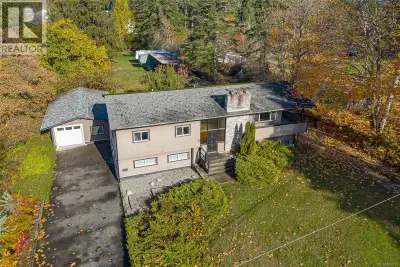 Discover this versatile two-storey home on a sprawling, level 1.5-acre lot located within the Urban...