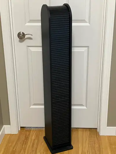 Roll top CD/DVD storage tower. Rolls closed to keep dust off cds and dvds. Will hold approximately 7...