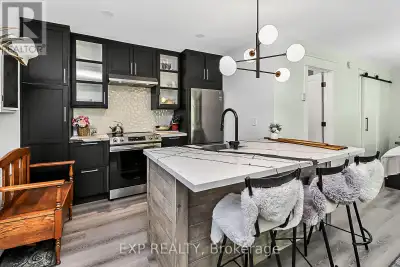 Step into this beautifully updated second-floor corner studio condo in the heart of Collingwood perf...