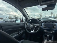 Designed for efficiency and confident urban navigation, this vibrant red 2024 Nissan Versa SV, is yo... (image 7)