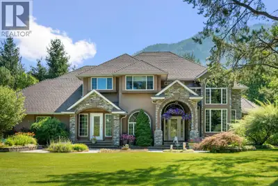 Set back off the road and nestled amongst the trees is this gorgeous custom built two-storey family...