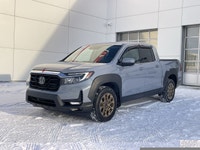 Our 2023 Honda Ridgeline Touring in Sonic Grey with the Honda Performance Development Package is in... (image 1)