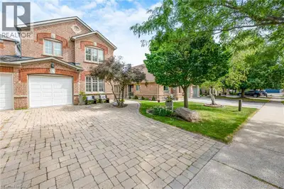 **Welcome to this Beautifully Renovated End-Unit Freehold Townhome in Desirable Millcroft!** This ho...