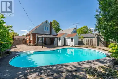 SUMMER AWAITS!! Family home with 3 bedrooms, 2 bathrooms that includes a convenient main floor bedro...
