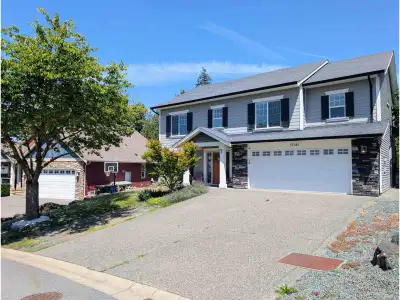 A stunning family home with a 1-bedroom suite with separate entry, tucked away in your quiet neighbo...