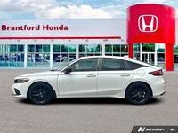 Boasting a spirited turbocharged engine, this 2022 Honda Civic Hatchback Sport Touring redefines dyn... (image 1)