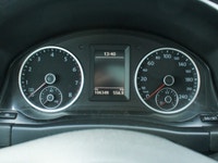 The 2012 Volkswagen Tiguan Highline in its sophisticated gray hue, paired with an agile AWD drivetra... (image 9)