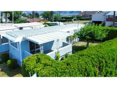 Tucked behind a wall of mature cedars, this charming two-bedroom home in a welcoming 55+ community o...