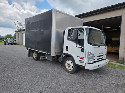 2019 Isuzu NRR, 12ft flat deck with roll-back tarp system. 5.2L I4 Isuzu diesel engine, automatic tr...